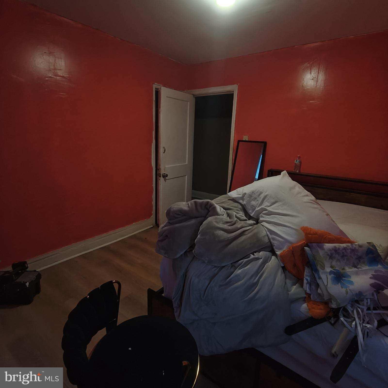 402 Long Lane Upper Darby, PA 19082 - Photo 14 of 20 a bed sitting in a bedroom next to a lamp