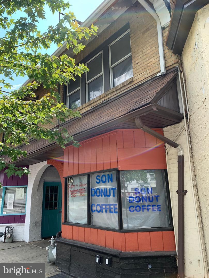 402 Long Lane Upper Darby, PA 19082 - Photo 2 of 7 a view of a brick building with a large windows