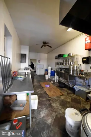 a gym area with lots of furniture and clutter