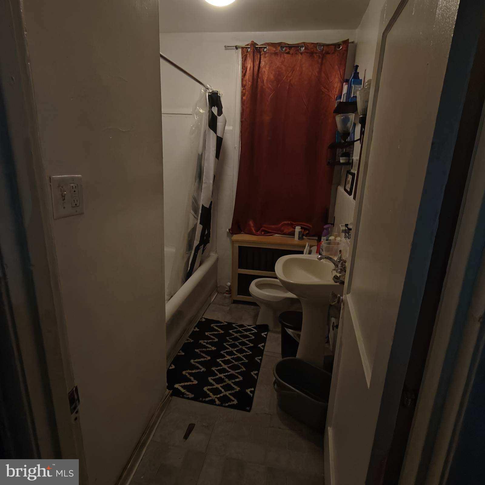 402 Long Lane Upper Darby, PA 19082 - Photo 8 of 20 a bathroom with a sink toilet and shower