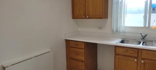 a view of cabinets with wooden floor