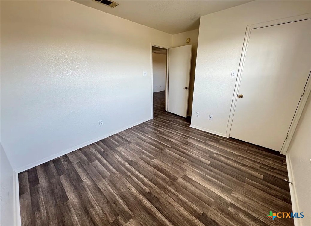 3404 Zephyr Road Killeen, TX 76543 - Photo 3 of 10 a view of an empty room with wooden floor