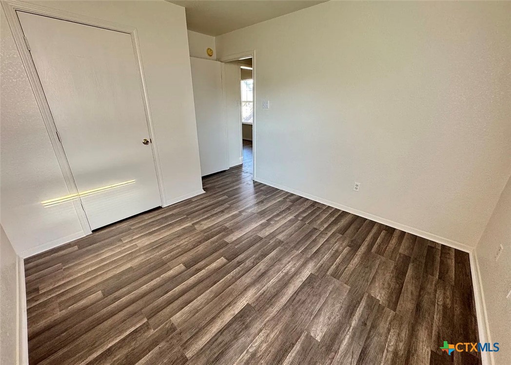 3404 Zephyr Road Killeen, TX 76543 - Photo 4 of 10 a view of an empty room with wooden floor and a window