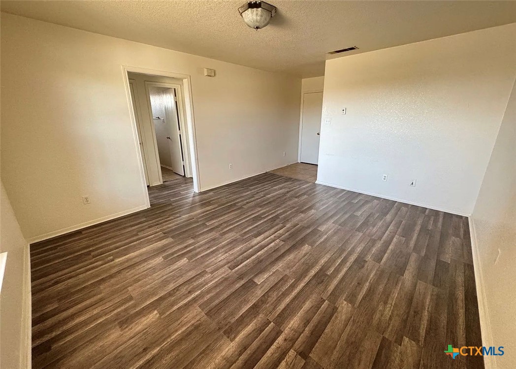 3404 Zephyr Road Killeen, TX 76543 - Photo 5 of 10 a view of an empty room with wooden floor