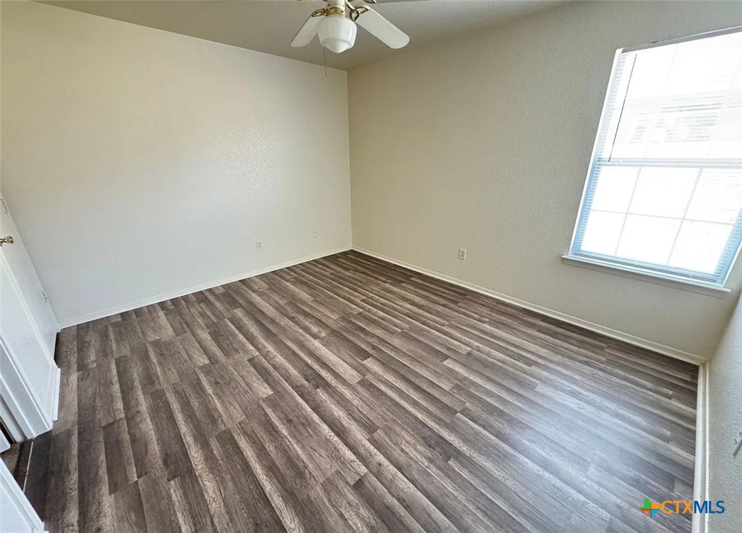 3404 Zephyr Road Killeen, TX 76543 - Photo 8 of 10 wooden floor in an empty room with a window