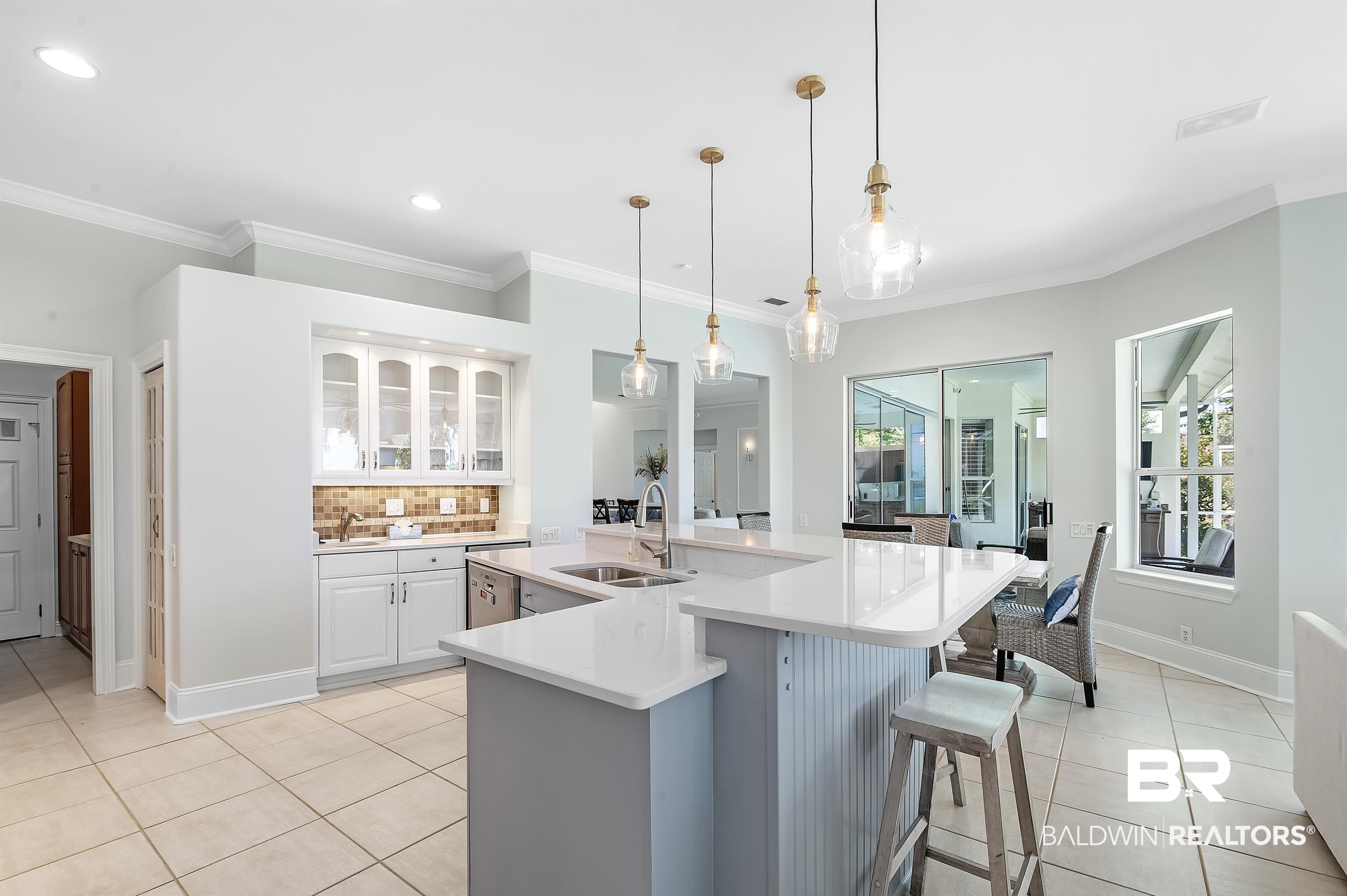 8160 Bay View Drive Foley, AL 36535 - Photo 16 of 43 Kitchen featuring new appliances, light tile patterned floors, white cabinetry, ornamental molding, and recessed lighting
