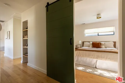 a view of walk in closet with empty room