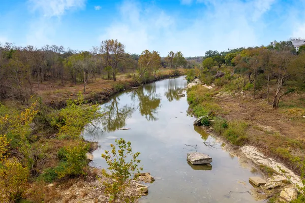 an aerial view of houses covered in trees