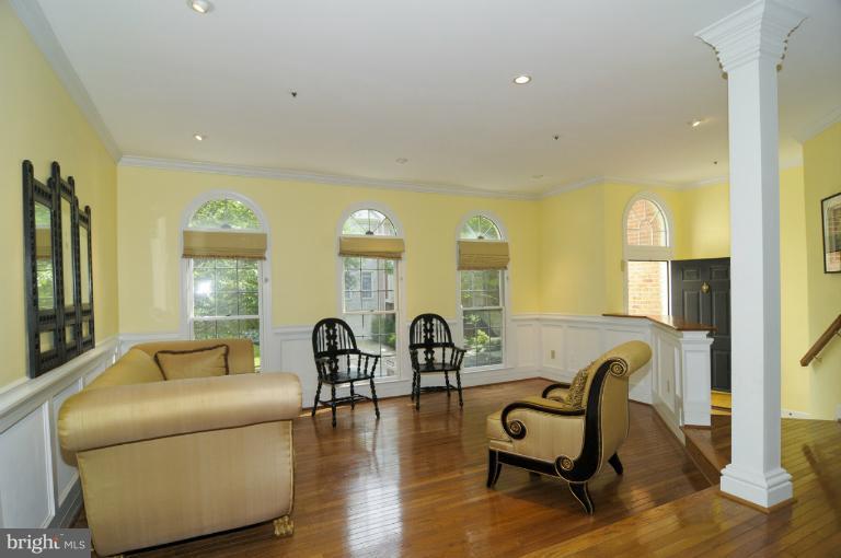 7841 Oracle Place Potomac, MD 20854 - Photo 16 of 29 a living room with furniture and a table