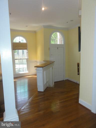 7841 Oracle Place Potomac, MD 20854 - Photo 3 of 29 wooden floor in an empty room with a window