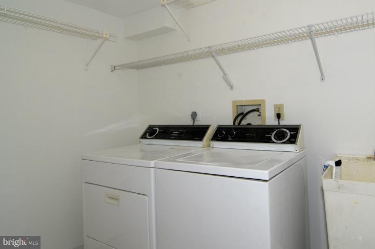 7841 Oracle Place Potomac, MD 20854 - Photo 21 of 29 a utility room with dryer and washer