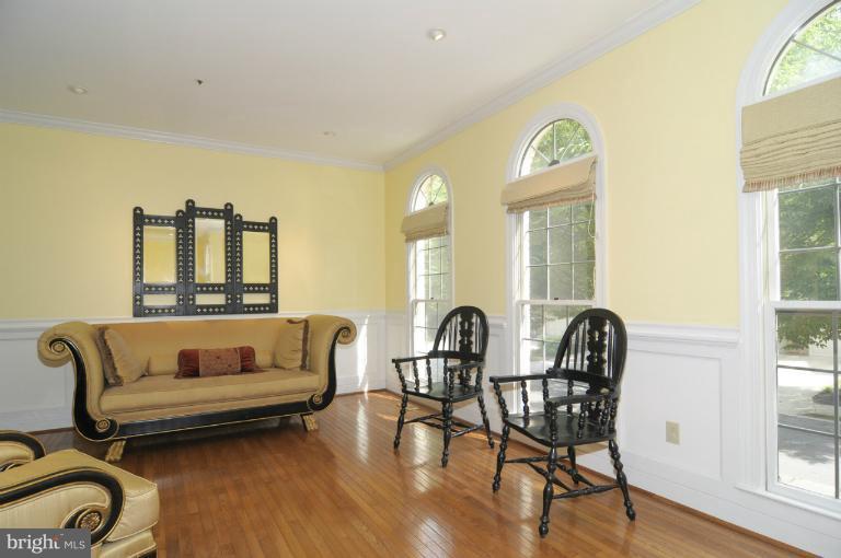 7841 Oracle Place Potomac, MD 20854 - Photo 23 of 29 a living room with furniture and wooden floor