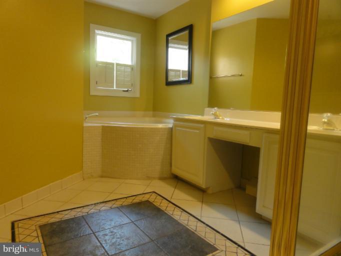 7841 Oracle Place Potomac, MD 20854 - Photo 4 of 29 a bathroom with a sink and a shower