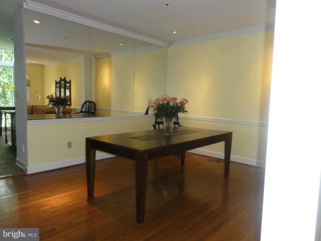 7841 Oracle Place Potomac, MD 20854 - Photo 6 of 29 a view of a dining room with furniture and wooden floor