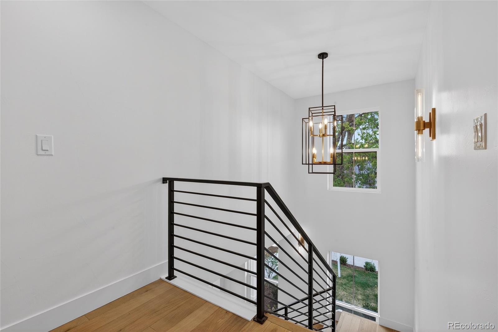 2362 South Acoma Street Denver, CO 80223 - Photo 21 of 50 a view of entryway and hall with wooden floor