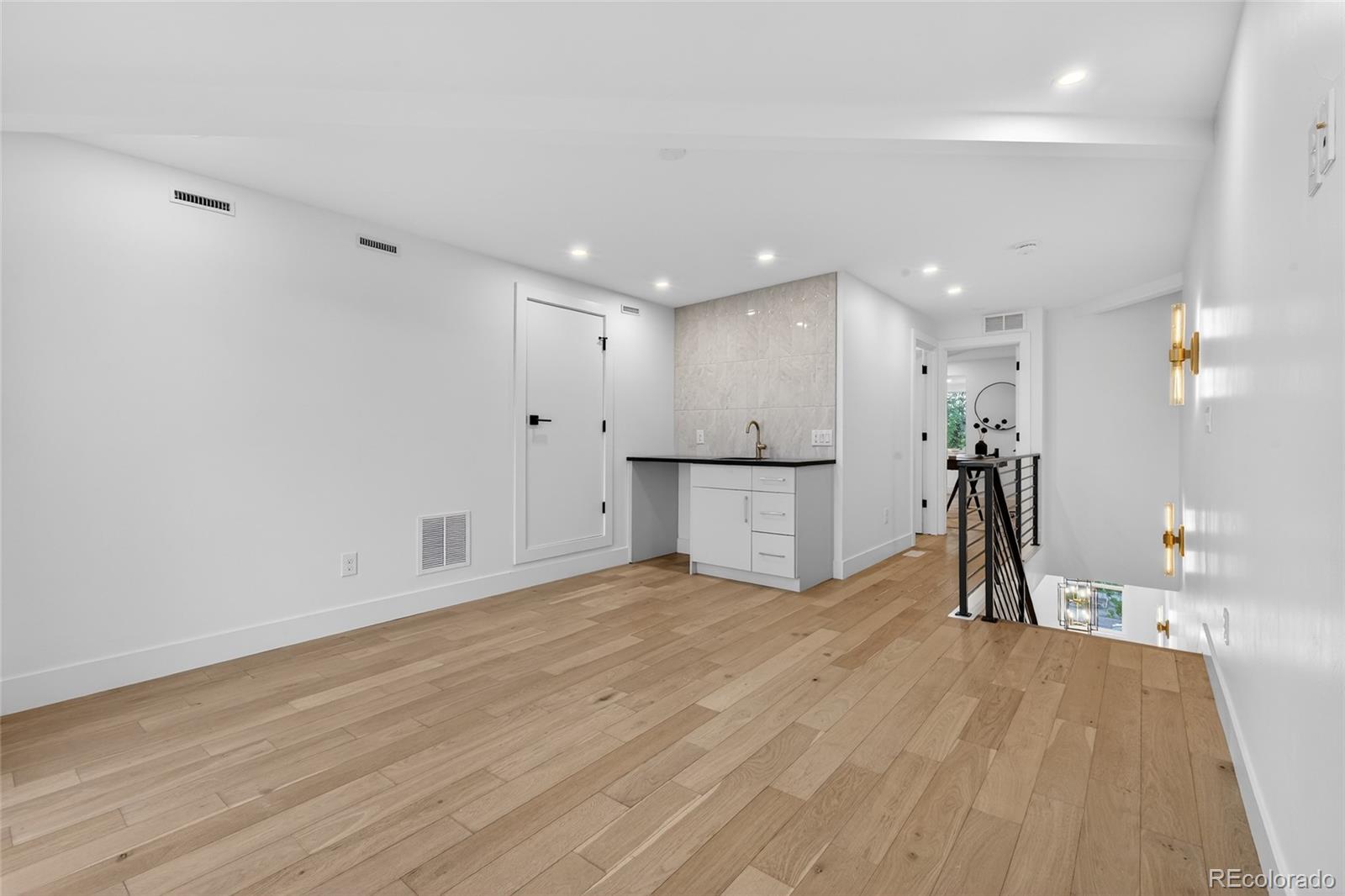 2362 South Acoma Street Denver, CO 80223 - Photo 35 of 50 a view of a room with wooden floor