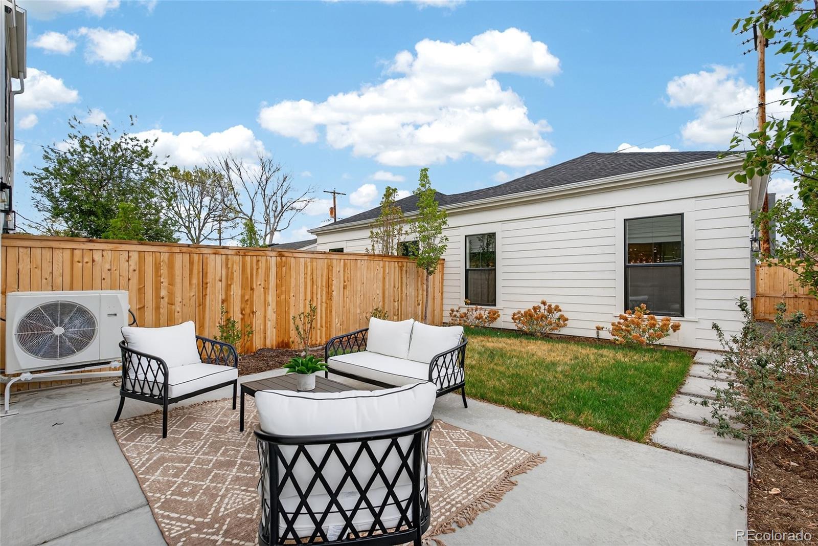 2362 South Acoma Street Denver, CO 80223 - Photo 42 of 50 a view of a patio with a table and chairs