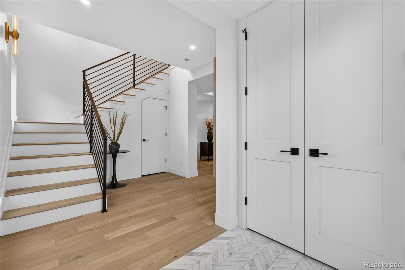 2362 South Acoma Street Denver, CO 80223 - Photo 8 of 50 a view of a hallway with wooden floor and entryway