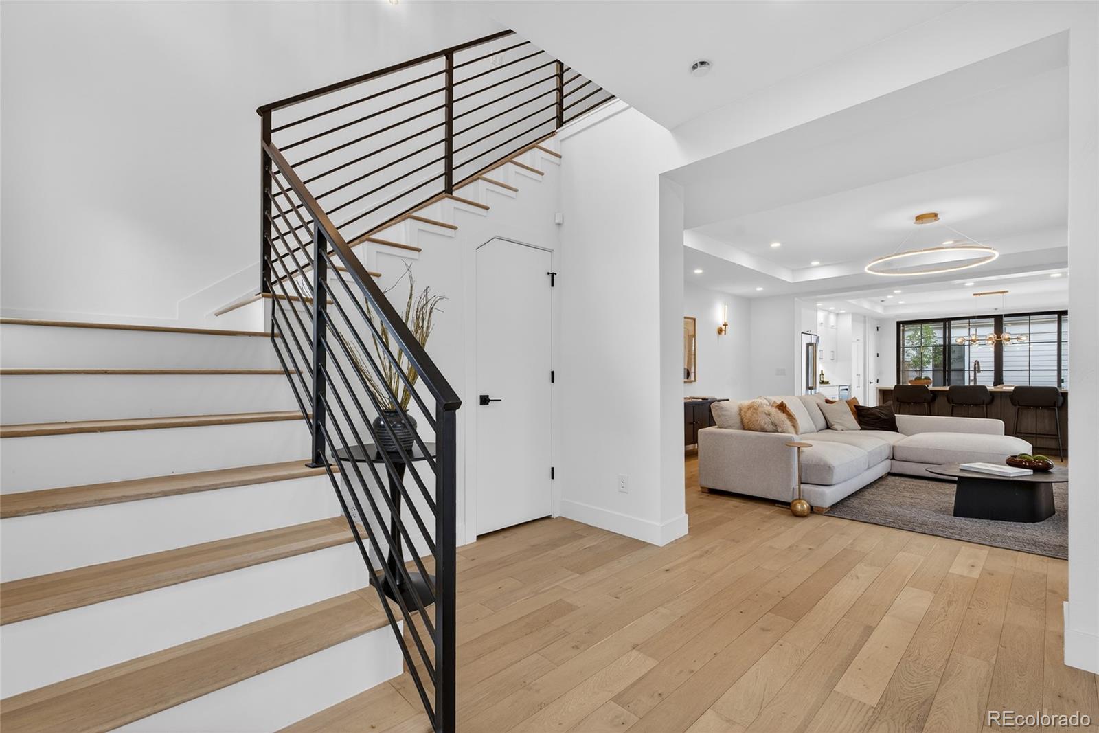 2362 South Acoma Street Denver, CO 80223 - Photo 9 of 50 a view of a livingroom with furniture and staircase
