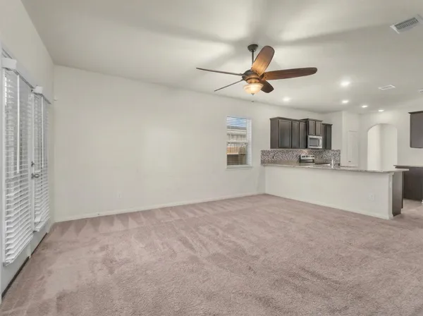 a view of a kitchen with a sink and cabinets