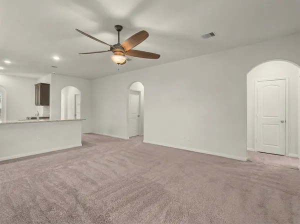 an empty room with a bathroom