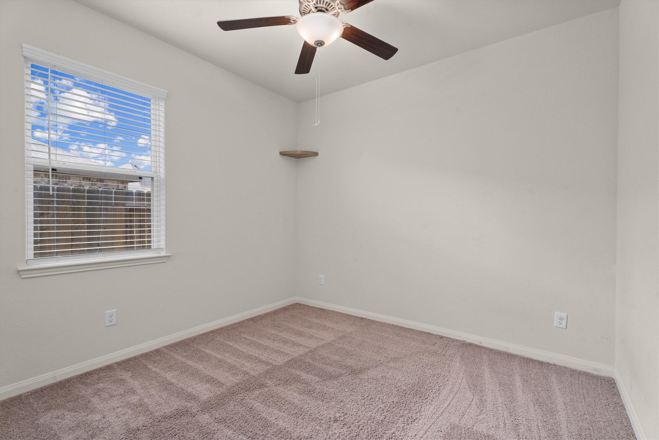 15215 Snowdrop Field Drive Humble, TX 77396 - Photo 21 of 35 an empty room with a window and a fan