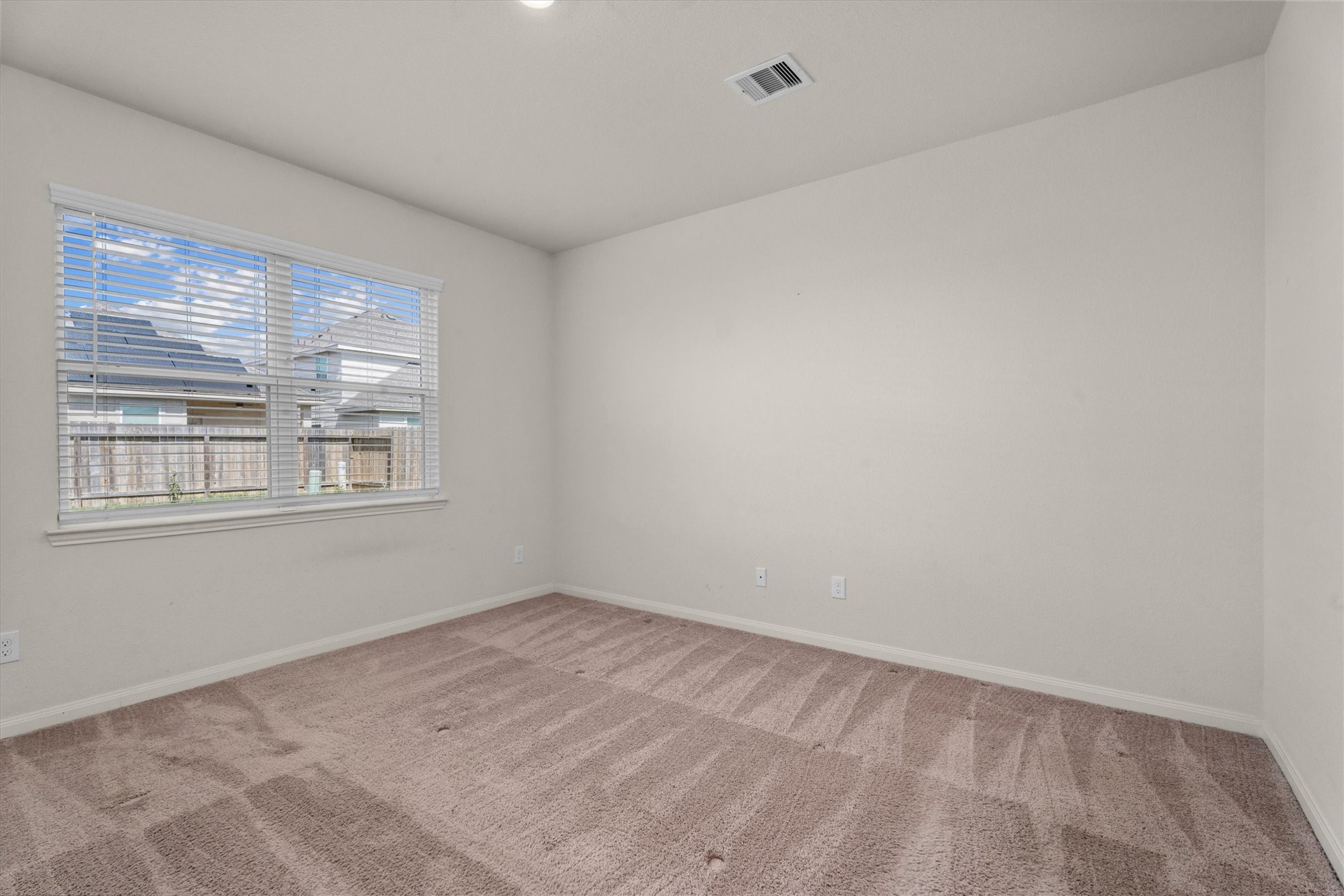15215 Snowdrop Field Drive Humble, TX 77396 - Photo 24 of 35 a view of an empty room with a window