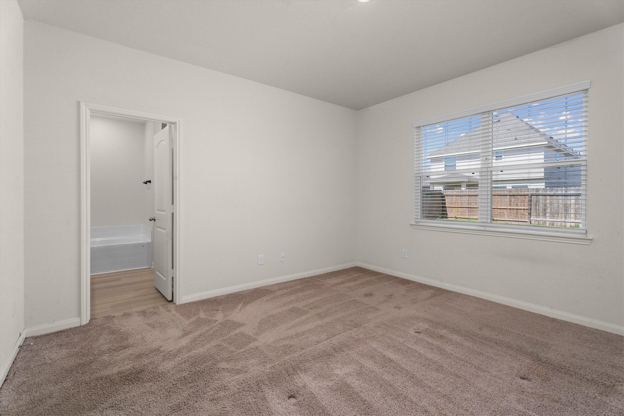 15215 Snowdrop Field Drive Humble, TX 77396 - Photo 25 of 35 a view of an empty room with a window