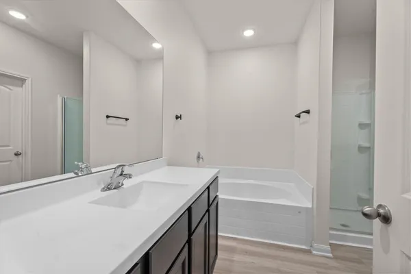 a bathroom with a bathtub and a sink