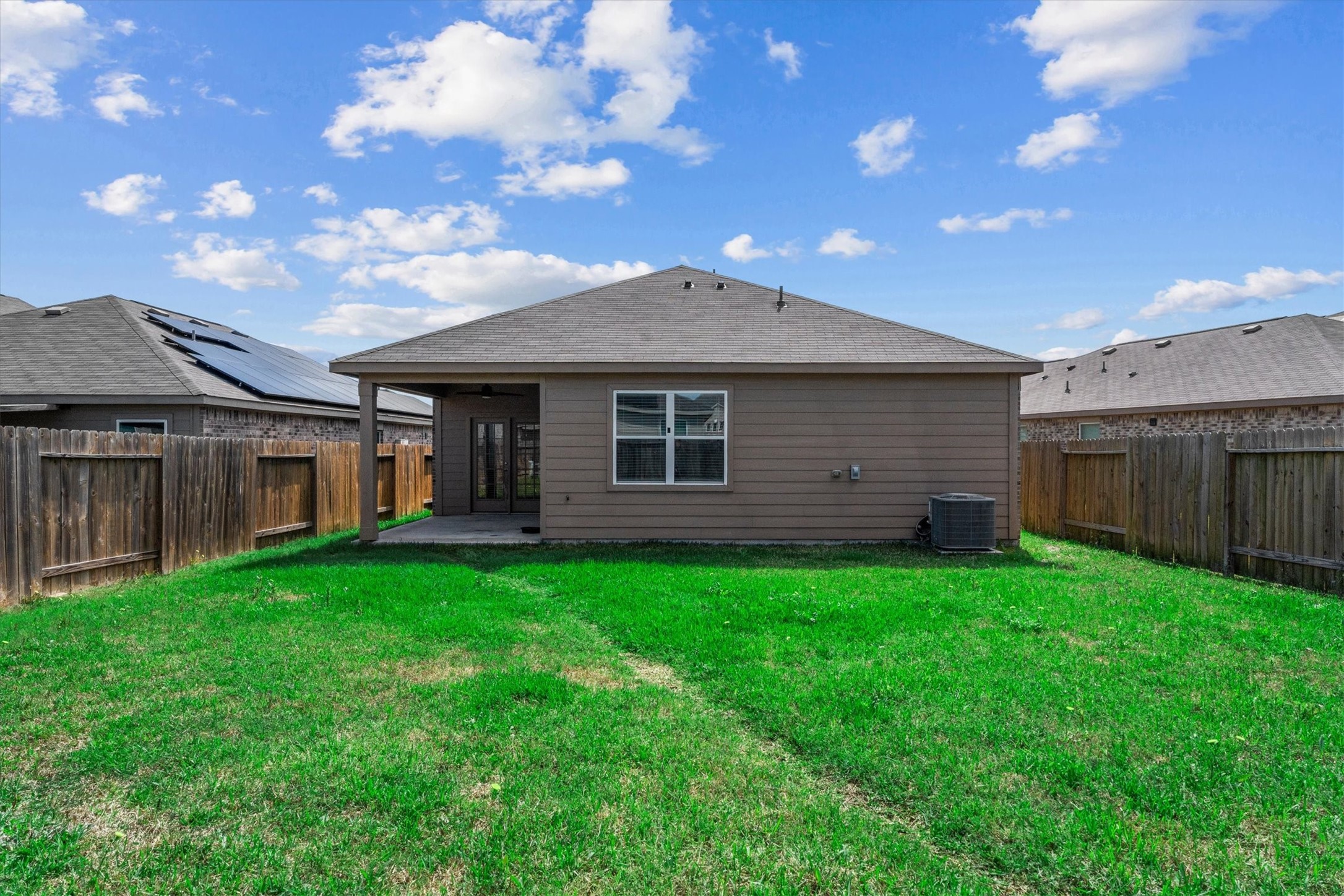 15215 Snowdrop Field Drive Humble, TX 77396 - Photo 33 of 35 a backyard of a house with table and chairs