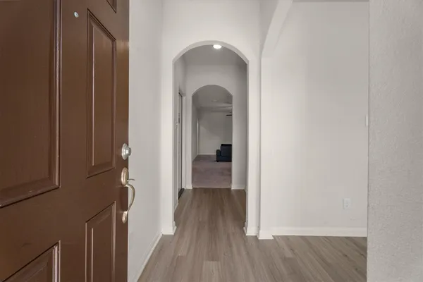 a view of a livingroom from a hallway