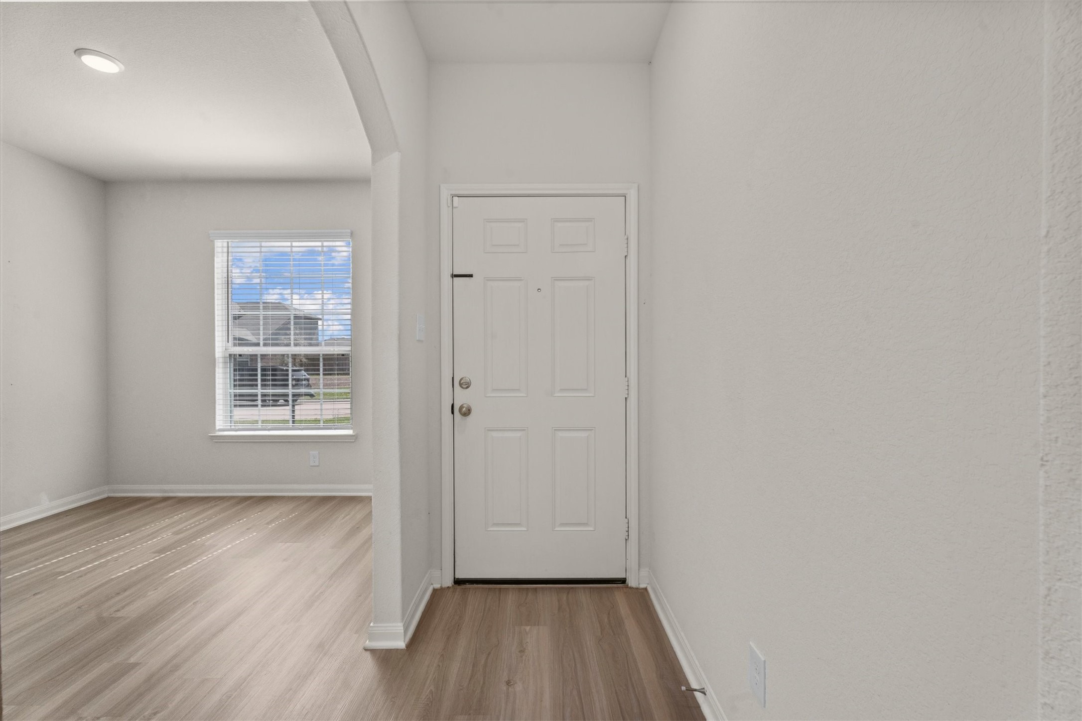 15215 Snowdrop Field Drive Humble, TX 77396 - Photo 5 of 35 a view of hallway with window and wooden floor
