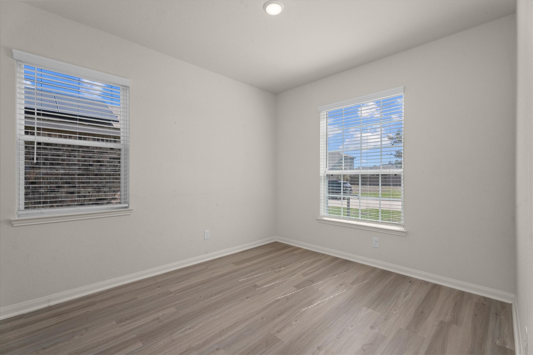 15215 Snowdrop Field Drive Humble, TX 77396 - Photo 7 of 35 a view of an empty room with wooden floor and a window