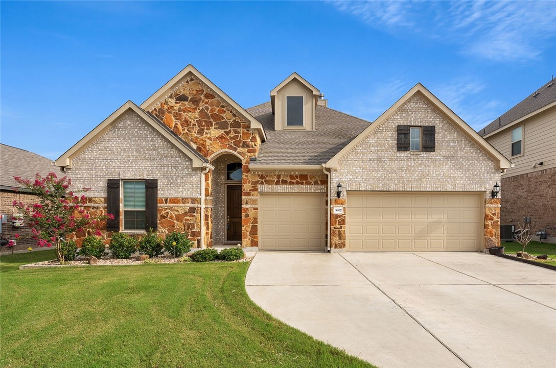 front view of a house with a yard