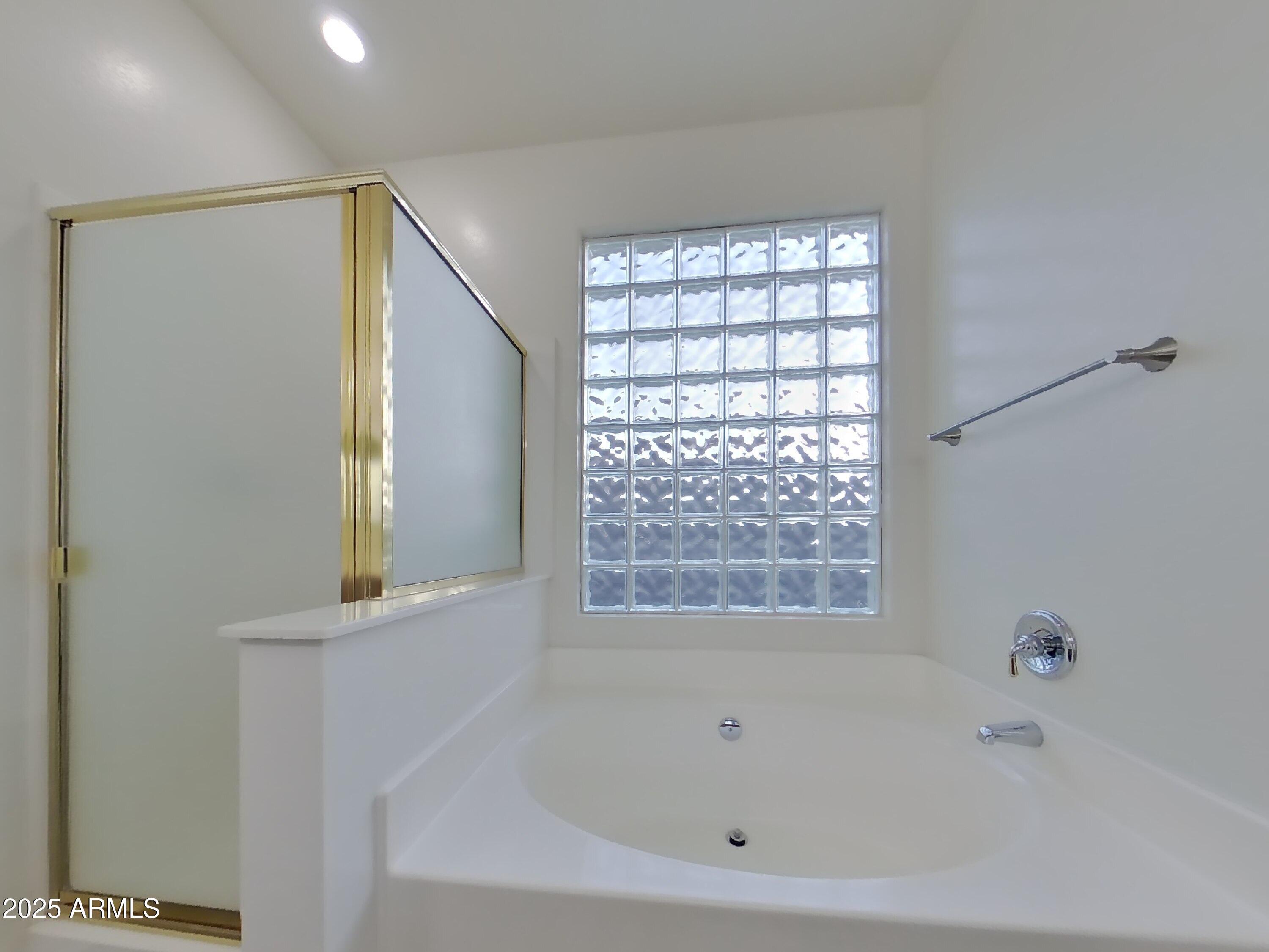 4333 East Ivanhoe Street Gilbert, AZ 85295 - Photo 11 of 16 a white bath tub sitting next to a window