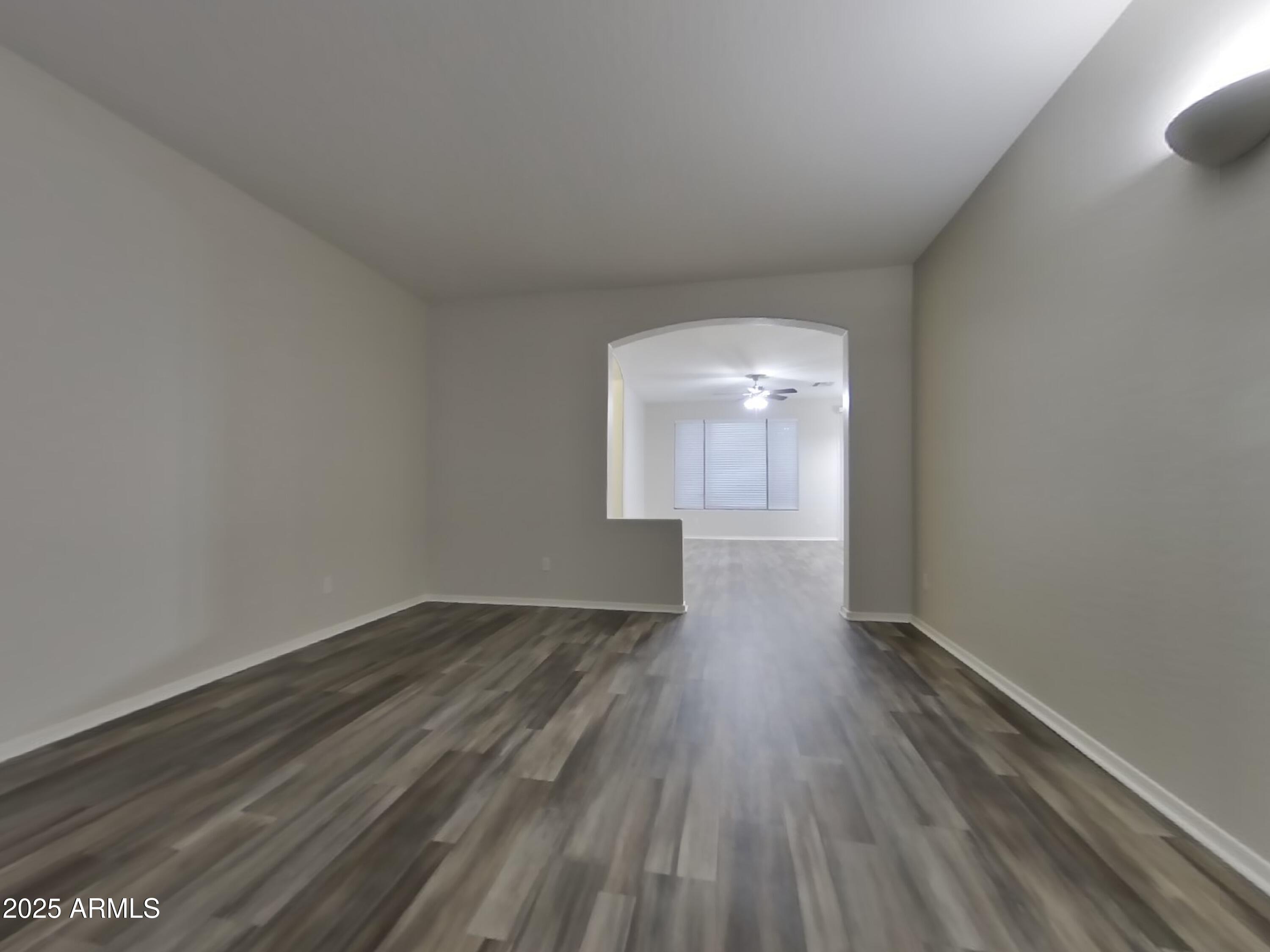 4333 East Ivanhoe Street Gilbert, AZ 85295 - Photo 3 of 16 a view of an empty room and wooden floor