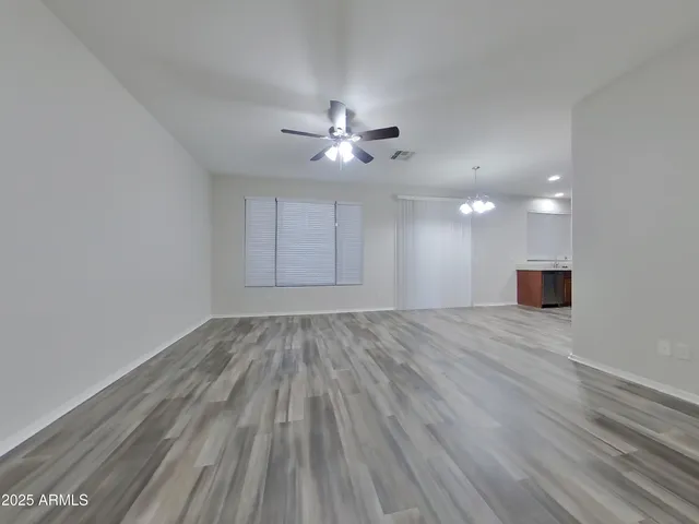 a view of a livingroom with wooden floor
