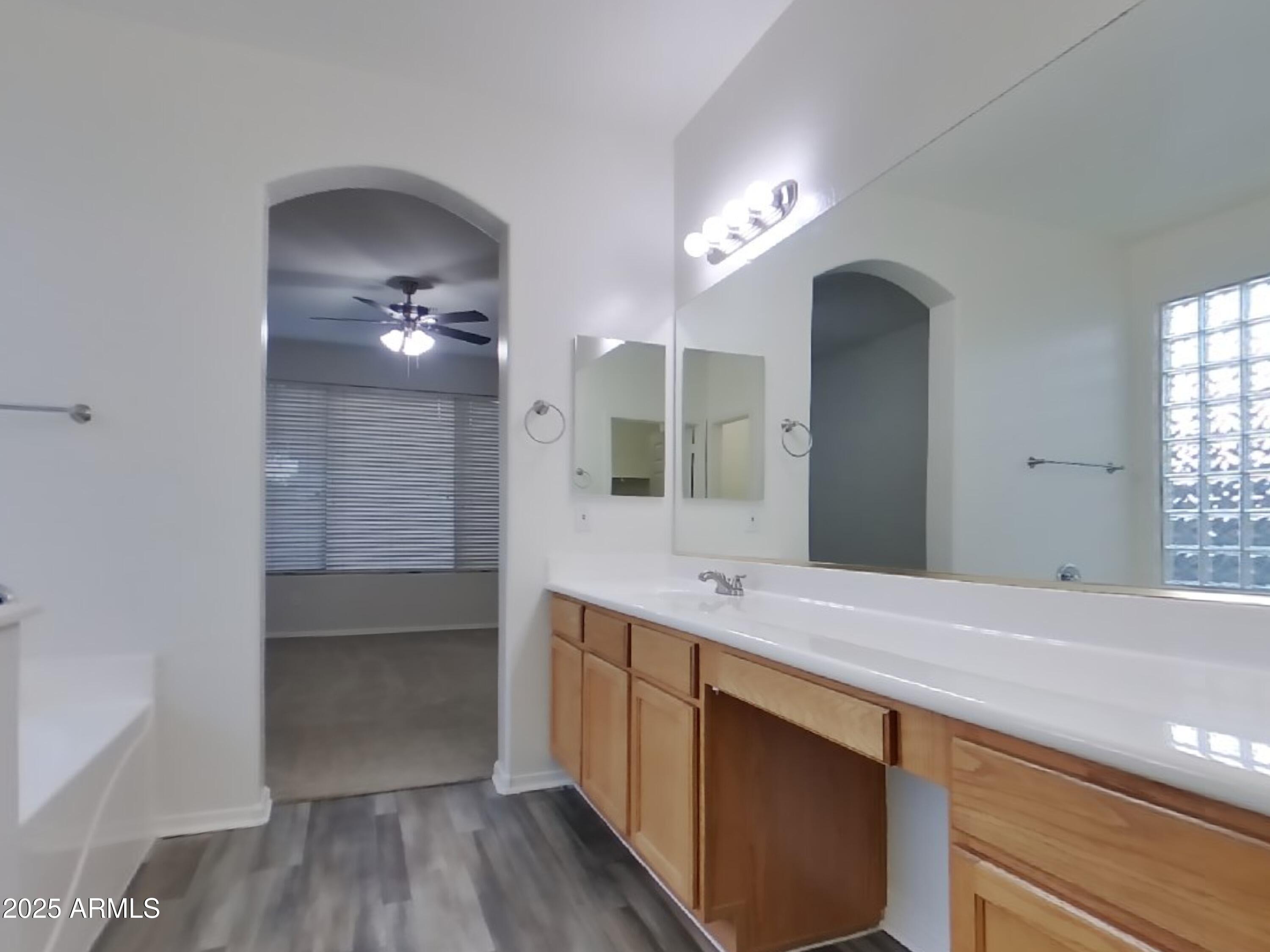 4333 East Ivanhoe Street Gilbert, AZ 85295 - Photo 9 of 16 a bathroom with a double vanity sink and a mirror