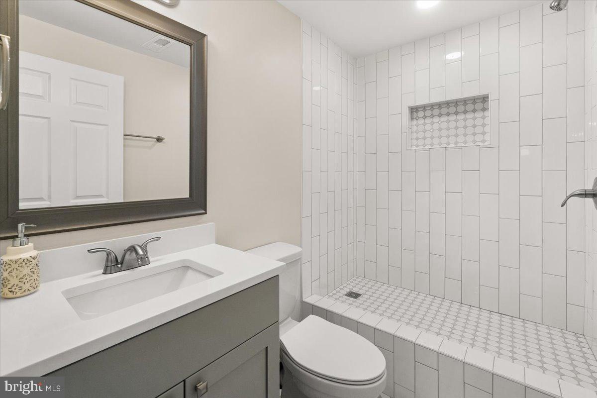 12426 Fingerboard Road Monrovia, MD 21770 - Photo 40 of 49 a bathroom with a sink a toilet and shower