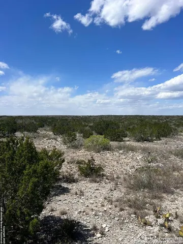a view of a chairs in front of a yard