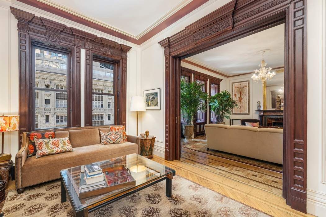 205 West 57th Street, Unit 9BBA Manhattan, NY 10019 - Photo 3 of 14 a living room with furniture and a large window