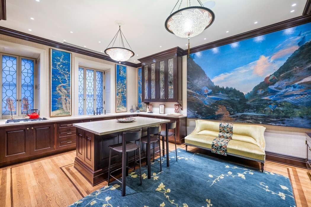 205 West 57th Street, Unit 9BBA Manhattan, NY 10019 - Photo 5 of 14 a kitchen that has a table and chairs in it