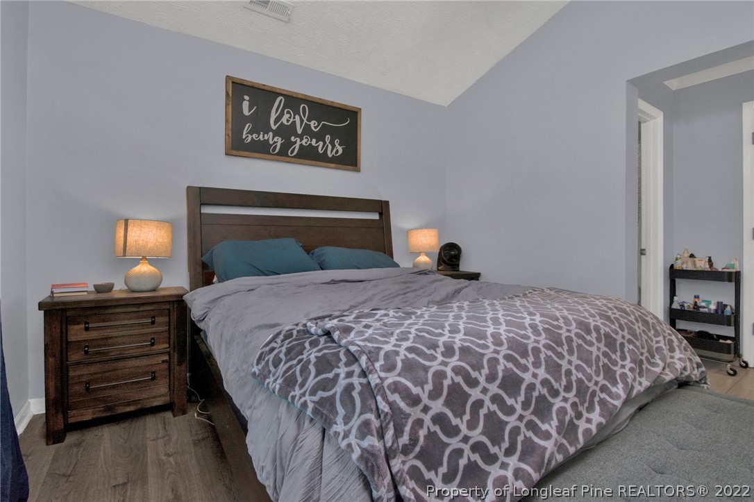 1021 Locks Creek Road Fayetteville, NC 28312 - Photo 23 of 34 a bedroom with a bed and dresser