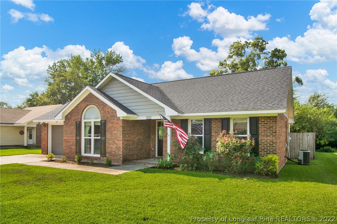 1021 Locks Creek Road Fayetteville, NC 28312 - Photo 3 of 34 a front view of a house with a garden
