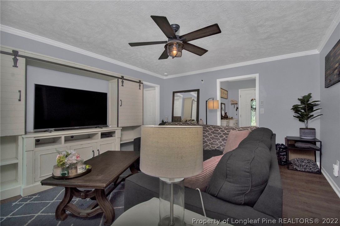 1021 Locks Creek Road Fayetteville, NC 28312 - Photo 6 of 34 a living room with furniture and a flat screen tv
