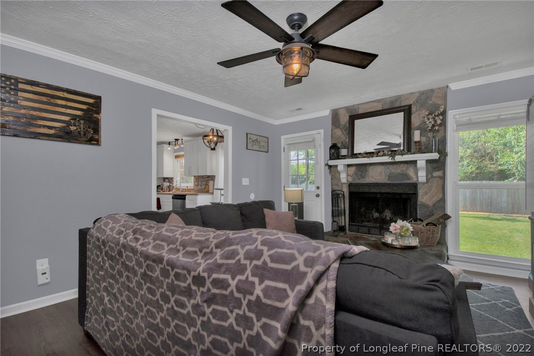 1021 Locks Creek Road Fayetteville, NC 28312 - Photo 7 of 34 a living room with furniture and a fireplace