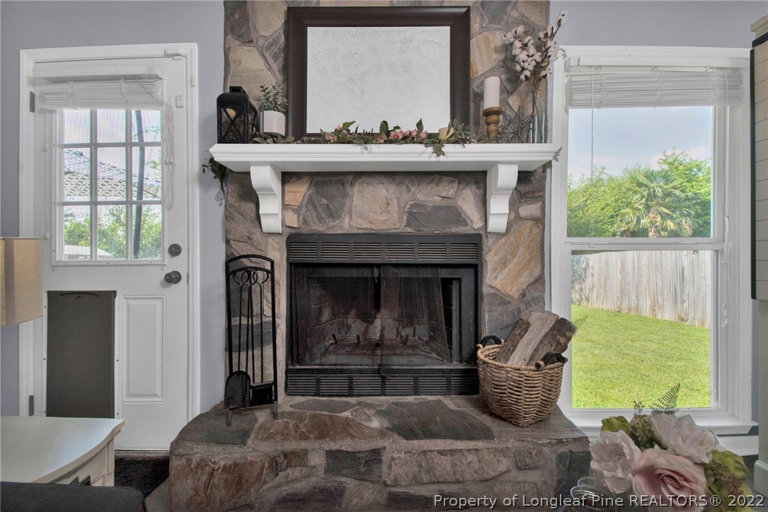 1021 Locks Creek Road Fayetteville, NC 28312 - Photo 10 of 34 a living room with furniture and a fireplace