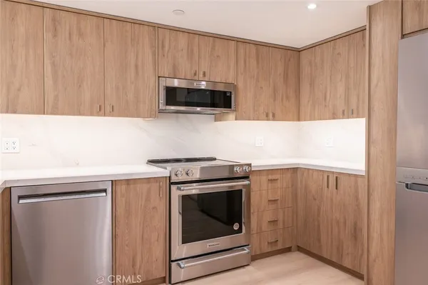 a kitchen with a stove and a microwave