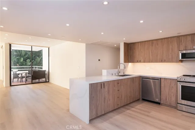 a kitchen with sink and cabinets