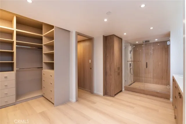 a view of an empty room with a kitchen